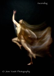 nude female leaping upward