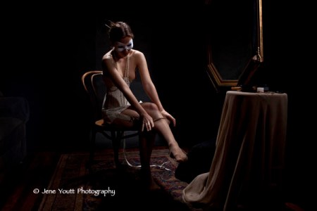 corseted female putting on stockings