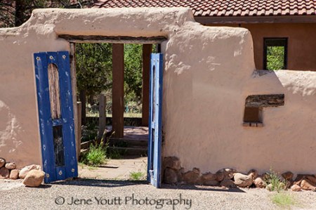 blue doors adobe building